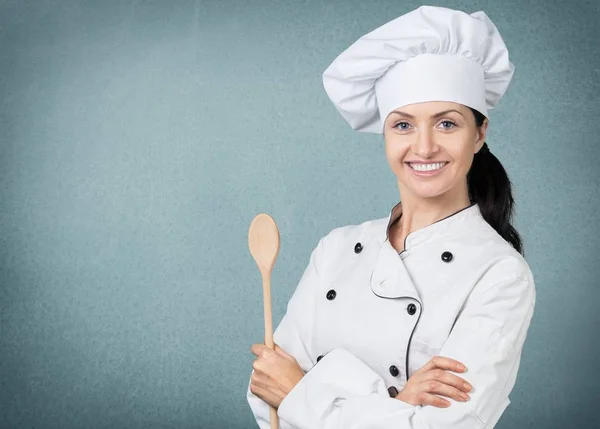 Junge Köchin mit Kochlöffel — Stockfoto