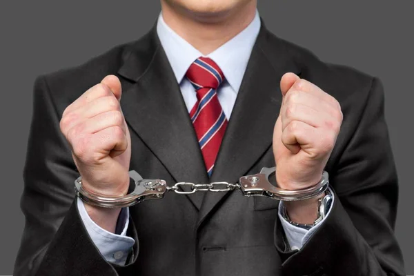 Man in metal handcuffs — Stock Photo, Image