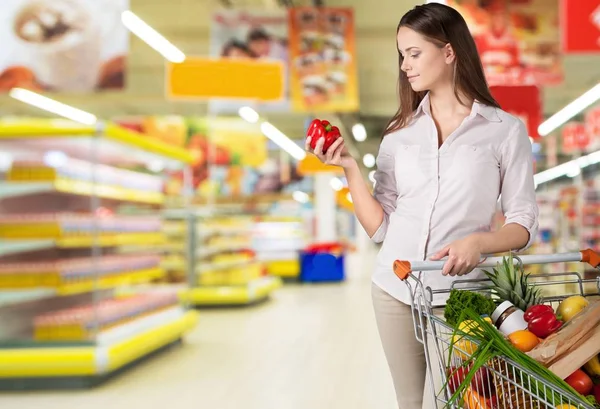 Woman with shopping cart — Stock Photo, Image