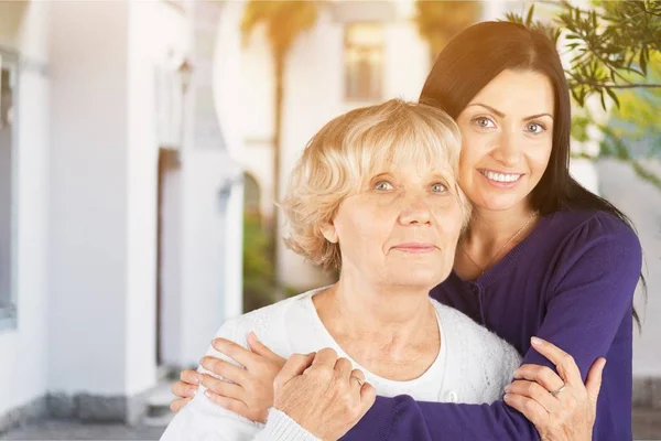 Young adult daughter with senior mother — Stock Photo, Image