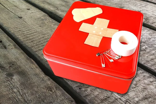 First aid kit  with medical supplies — Stock Photo, Image