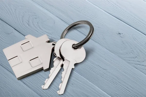 Silver Home key with badge — Stock Photo, Image