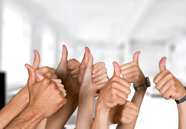 Hands showing thumbs up signs — Stock Photo, Image