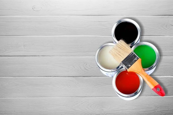 Paint brush and paint cans — Stock Photo, Image