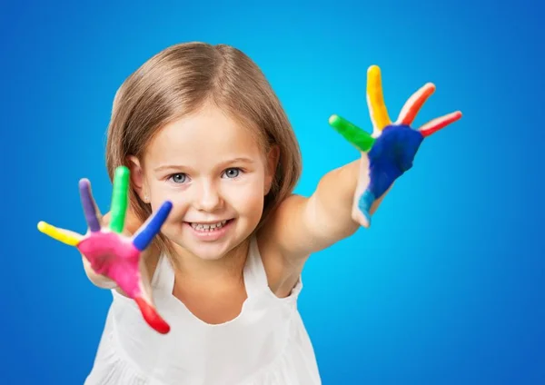 Little girl showing painted hands — Stock Photo, Image