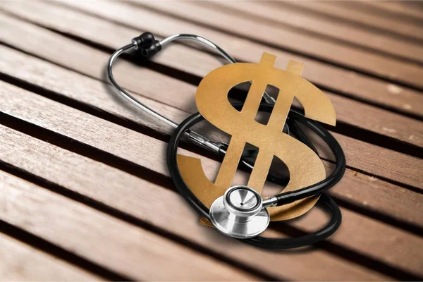 Stethoscope and dollar sign — Stock Photo, Image