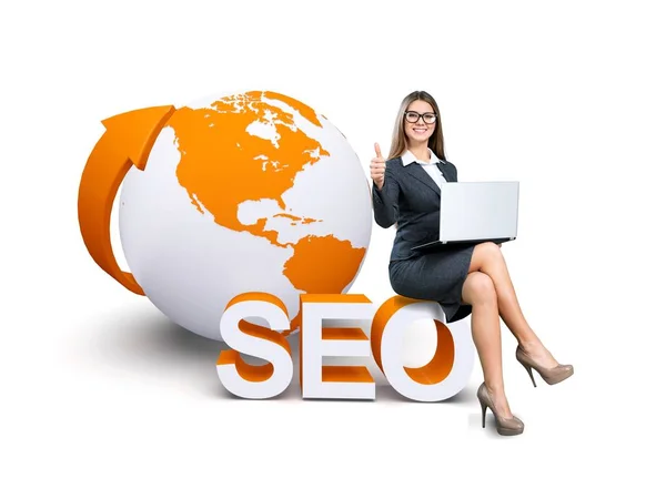 Young businesswoman with seo sign — Stock Photo, Image