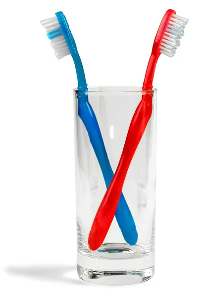Kleurrijke tandenborstels in lass — Stockfoto