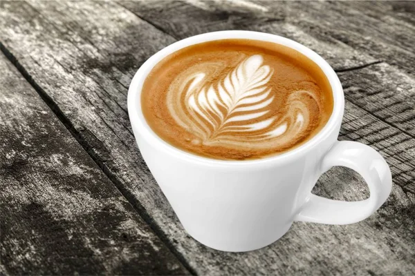 Gott kaffe med blommiga sign av skum — Stockfoto