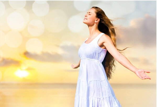 Woman in white dress with opened hands 