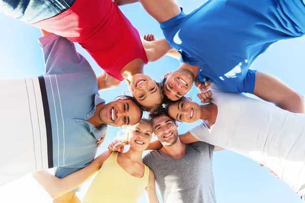 People hugging in circle Stock Picture