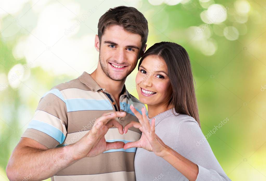 couple make heart from hands