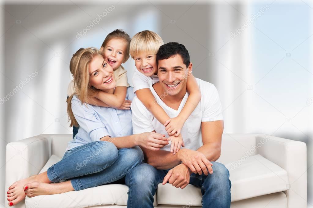 Beautiful smiling family in room 