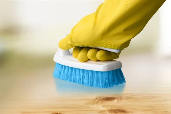 Yellow cleaning glove with a brush — Stock Photo, Image