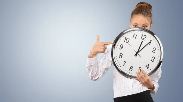 Businesswoman holding clock — Stock Photo, Image