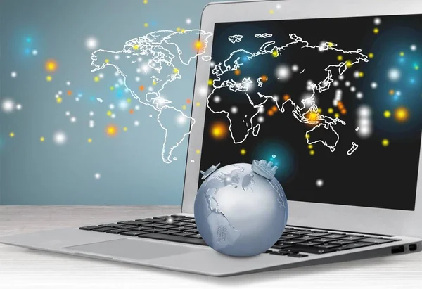 Glass globe on laptop — Stock Photo, Image