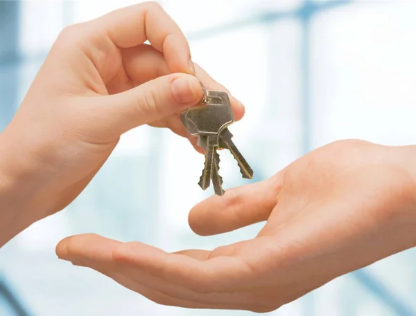 Hand giving set of house keys — Stock Photo, Image