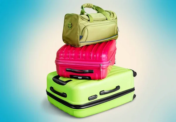 Colorful suitcases and backpack — Stock Photo, Image