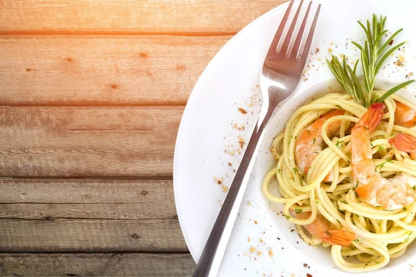 Pasta with prawns in white plate — Stock Photo, Image