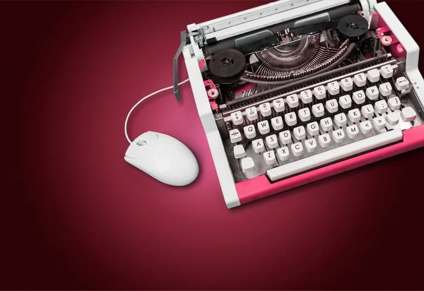 Old typewriter with computer mouse — Stock Photo, Image