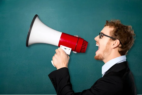 Business man with megaphone — Stock Photo, Image