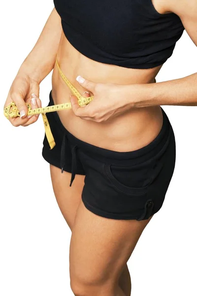 Young woman measuring her thin waist — Stock Photo, Image