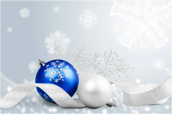 Christmas balls in snowflakes — Stock Photo, Image