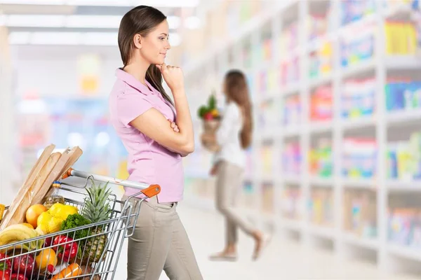 young woman in grocery shop
