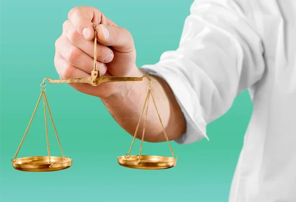 Justice Scales in hand — Stock Photo, Image