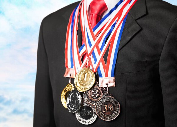 Businessman wearing sport medals