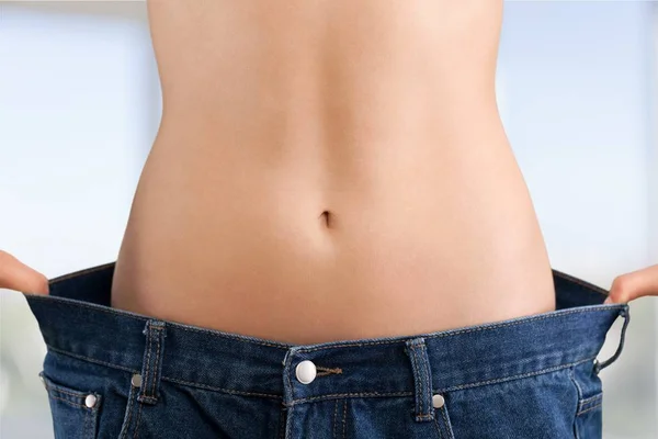 Young woman showing waist — Stock Photo, Image