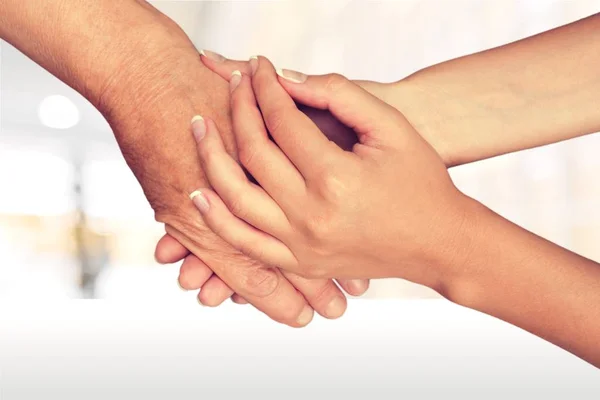 Old and young hands — Stock Photo, Image