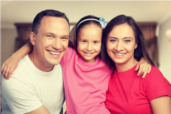 Happy smiling family with daughter — Stock Photo, Image