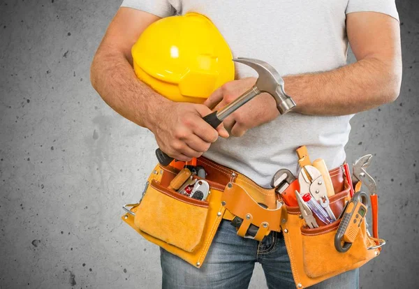 Worker with a tool belt — Stock Photo, Image