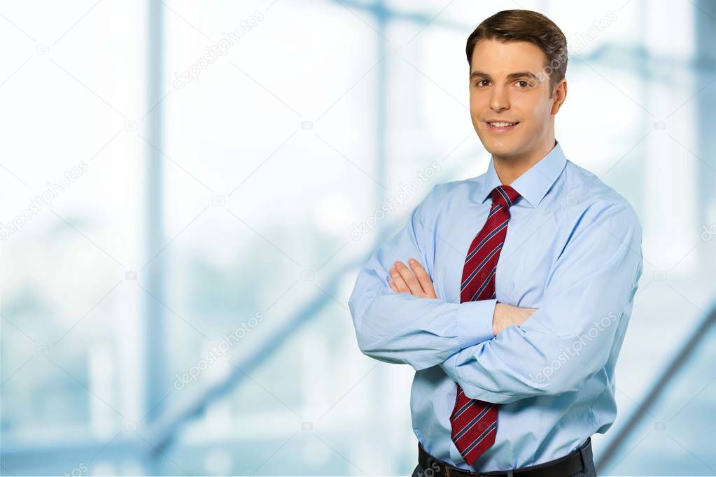 businessman standing with arms crossed