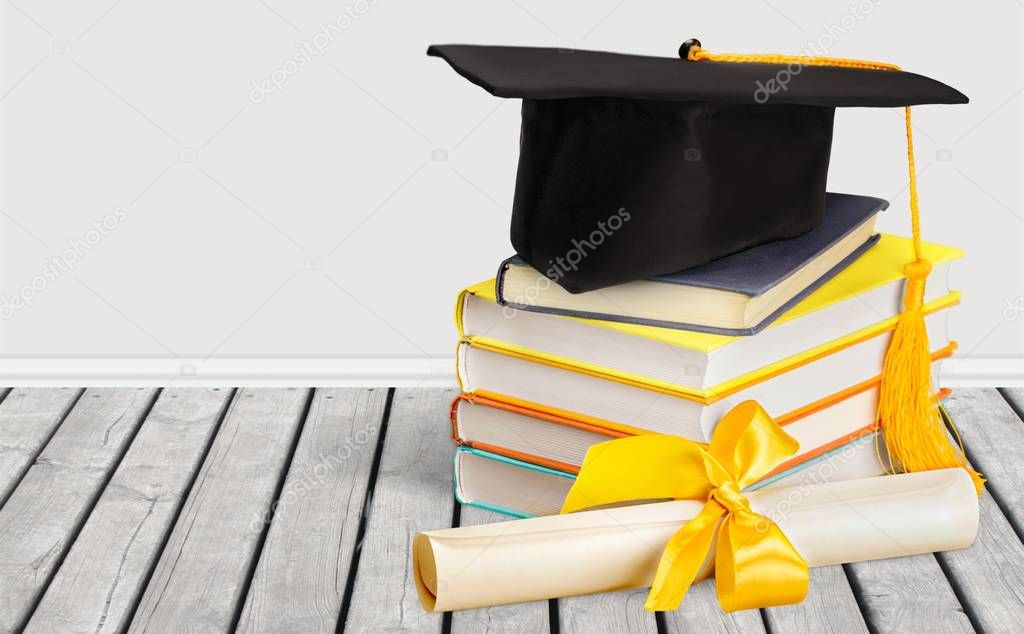 Graduation hat on stack of book