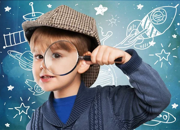 Boy with magnifying glass — Stock Photo, Image