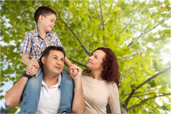 Happy smiling family with son