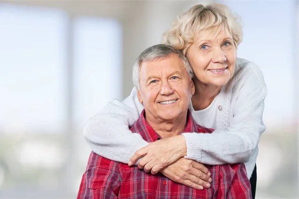 Elderly couple hugging — Stock Photo, Image