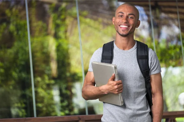 Student holding laptop — Stock Photo, Image