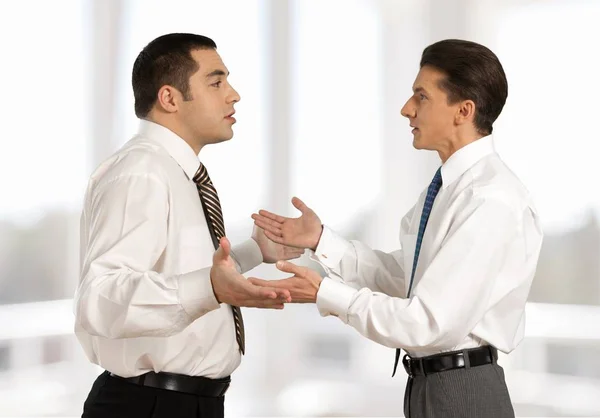 Two businessmen arguing