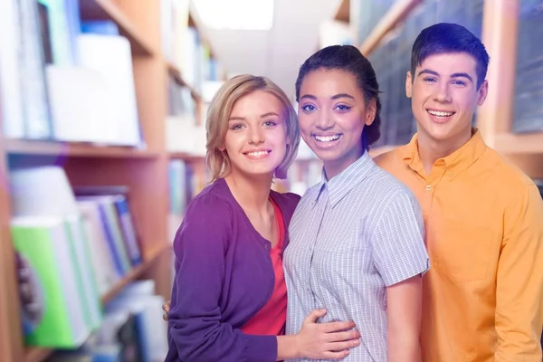 Young students in library — Stock Photo, Image