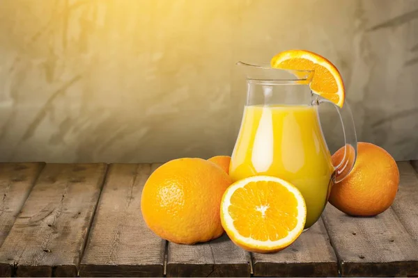 Jug of delicious orange juice — Stock Photo, Image