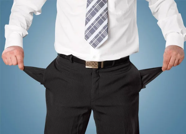 Businessman with empty pockets — Stock Photo, Image