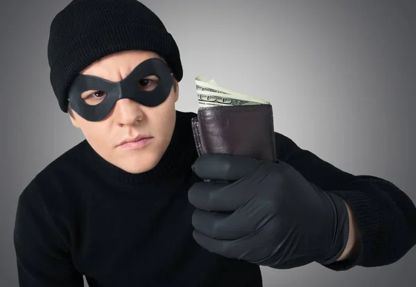Ladrão segurando carteira — Fotografia de Stock