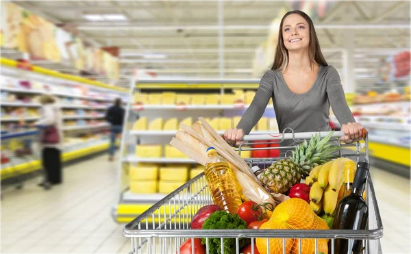 Woman shopping in grocery store Stock Picture