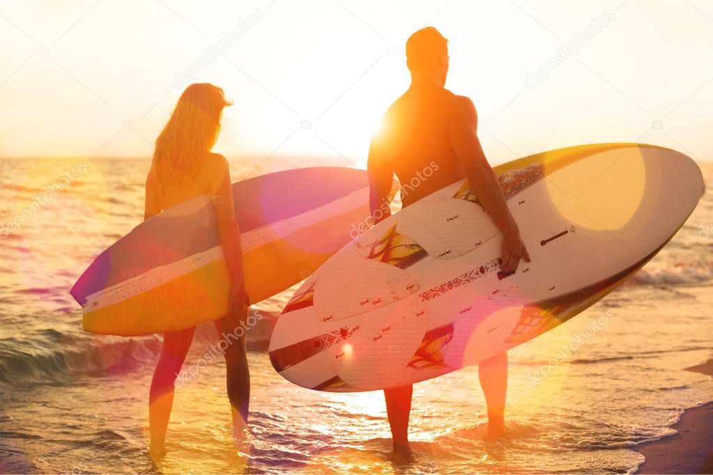male and female surfers