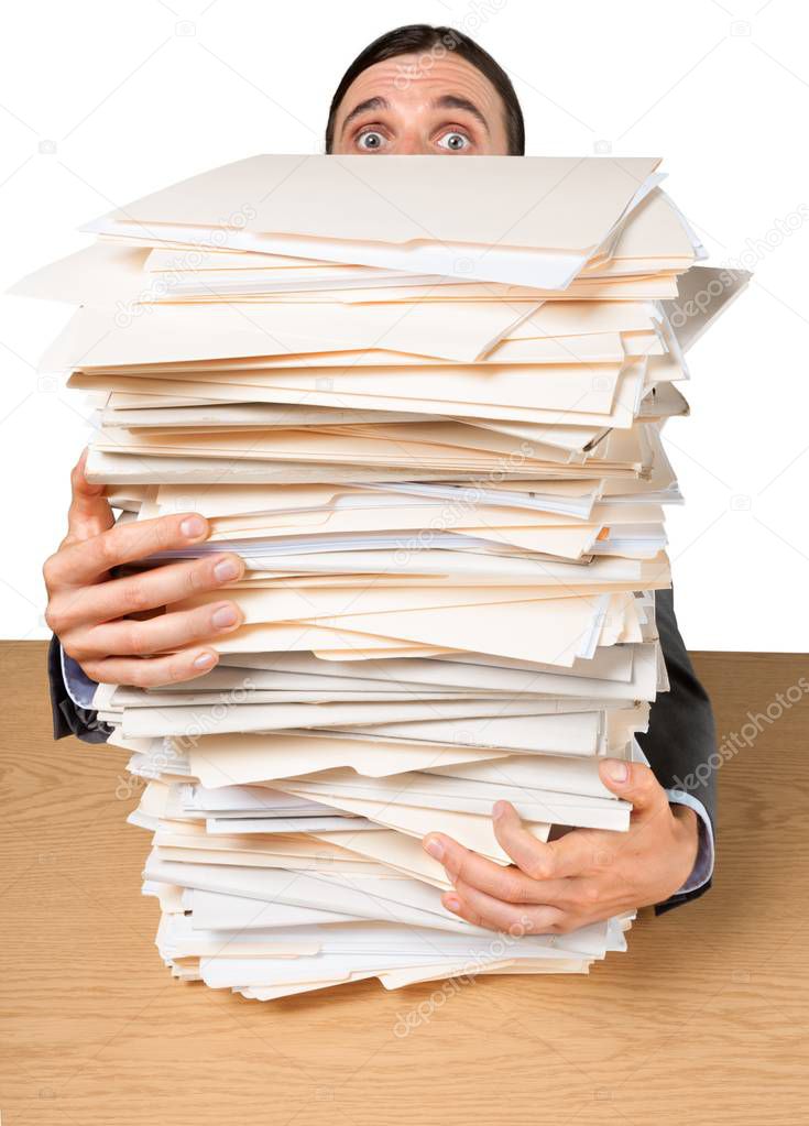 Man with stack of folders