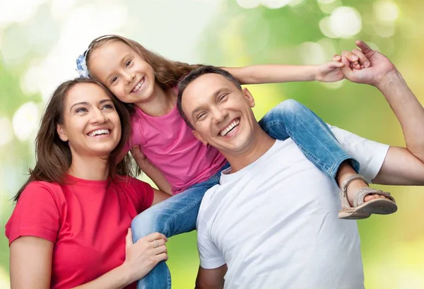 Happy smiling family with daughter — Stock Photo, Image