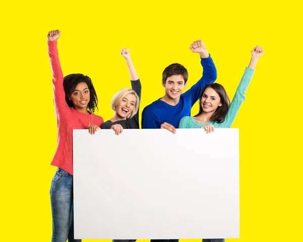 Teens holding blank banner — Stock Photo, Image